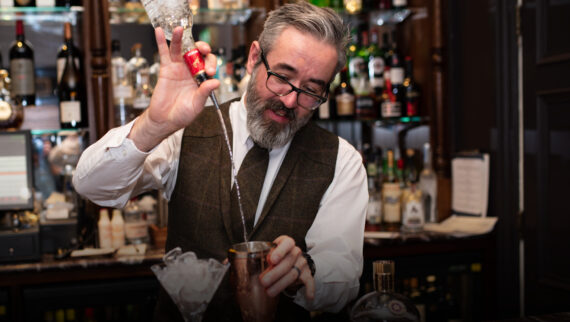 Image of the bar tender making a cocktail